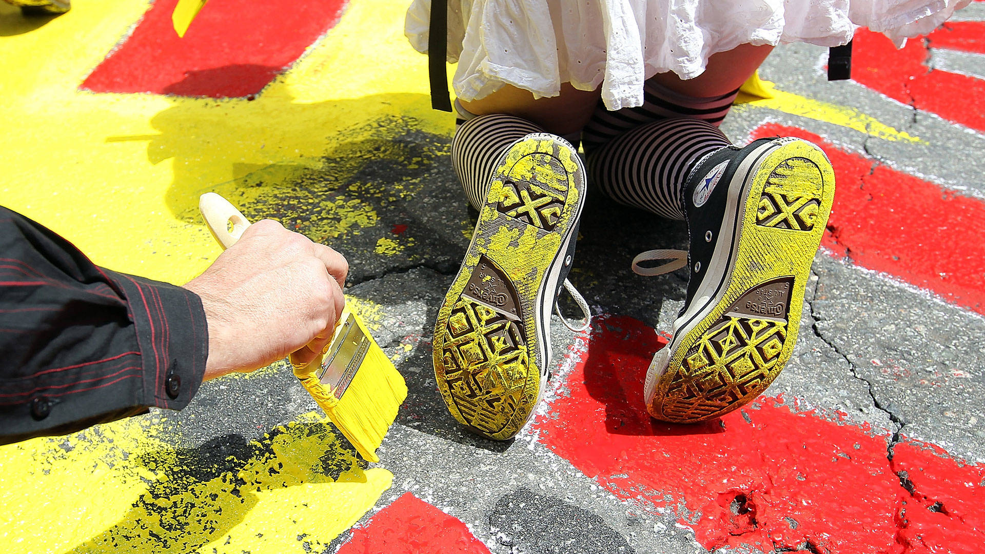 Demonstrators paint a mural on the street at the intersection of Market and Montgomery Streets in San Francisco in 2012. Justin Sullivan/Getty Images