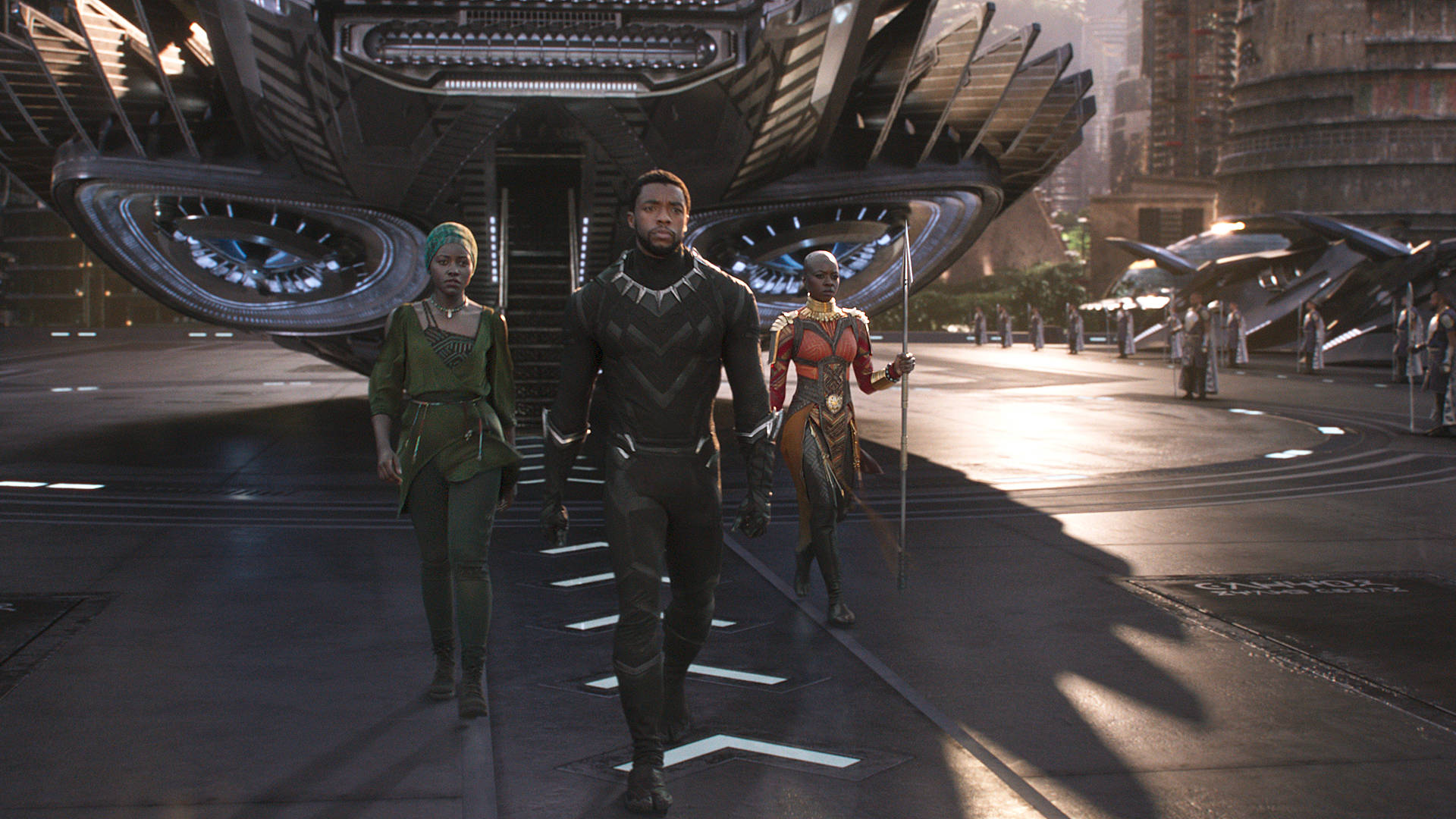 Nakia (Lupita Nyong'o), T'Challa/Black Panther (Chadwick Boseman) and Okoye (Danai Gurira), left to right, in Marvel's 'Black Panther.' Film Frame © Marvel Studios 2018