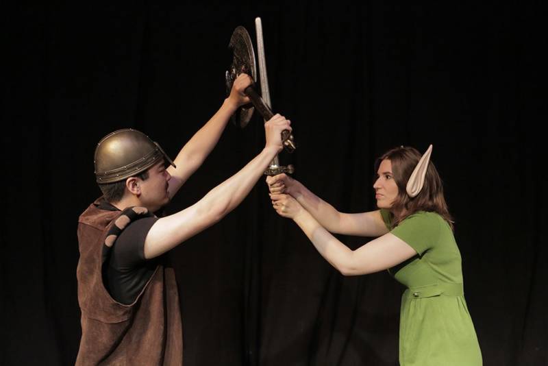 two actors perform in 'viking' costumes on stage