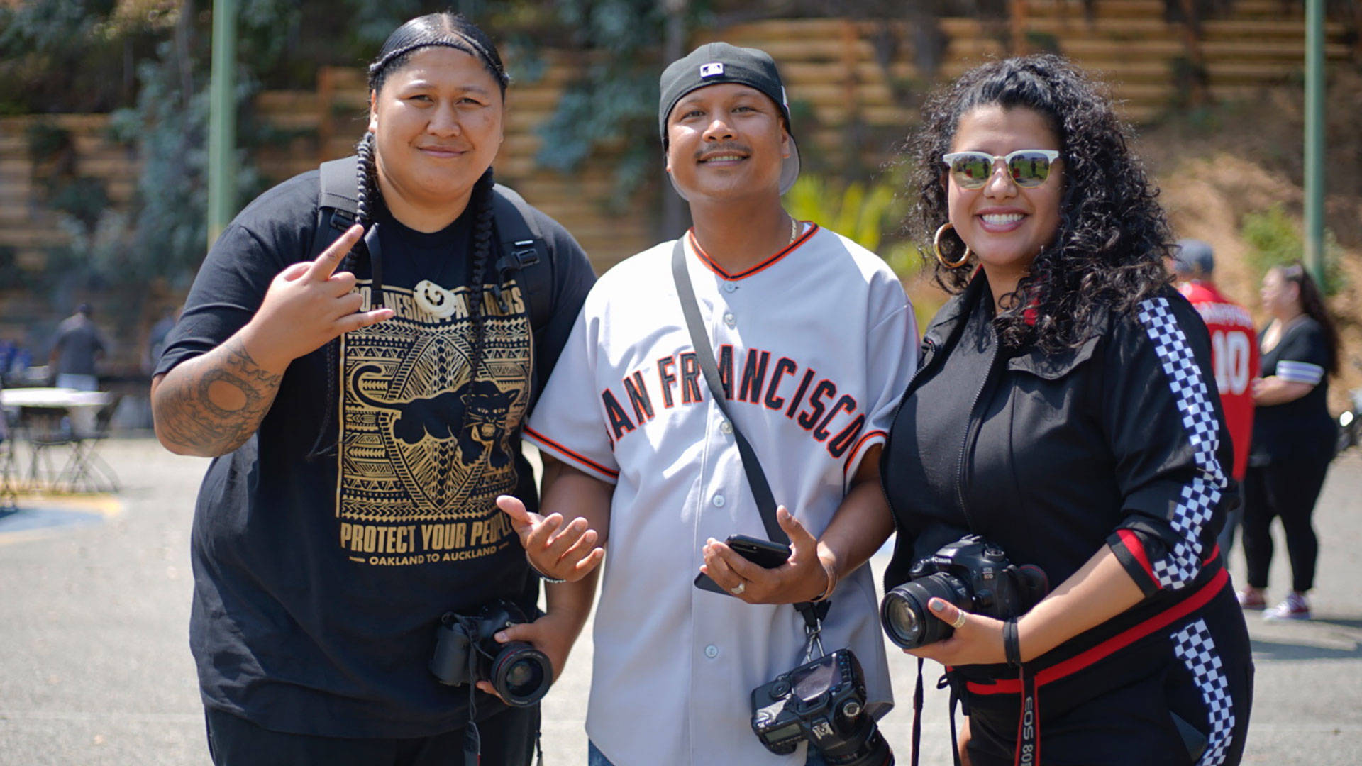 Jean Melesaine, left, with friends at the 'All My Usos' barbecue at Gilman Park in Bayview / Hunters Point. Pendarvis Harshaw