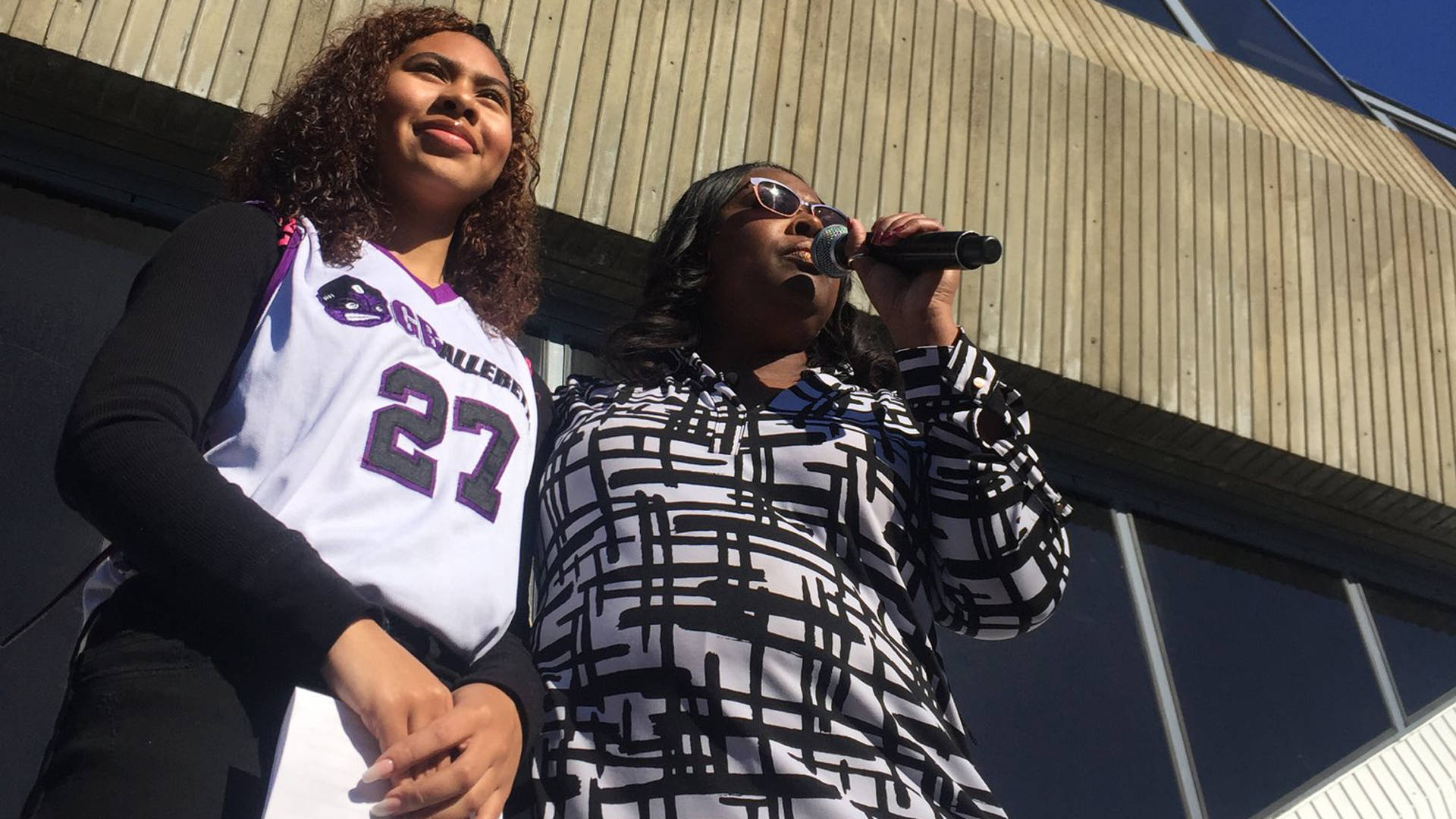 Oscar Grant’s daughter Tatiana Grant (left) and mother Wanda Johnson (right) speaking at the Fruitvale Station vigil to mark a decade since Oscar was shot and killed by a BART police officer. Sandhya Dirks/KQED