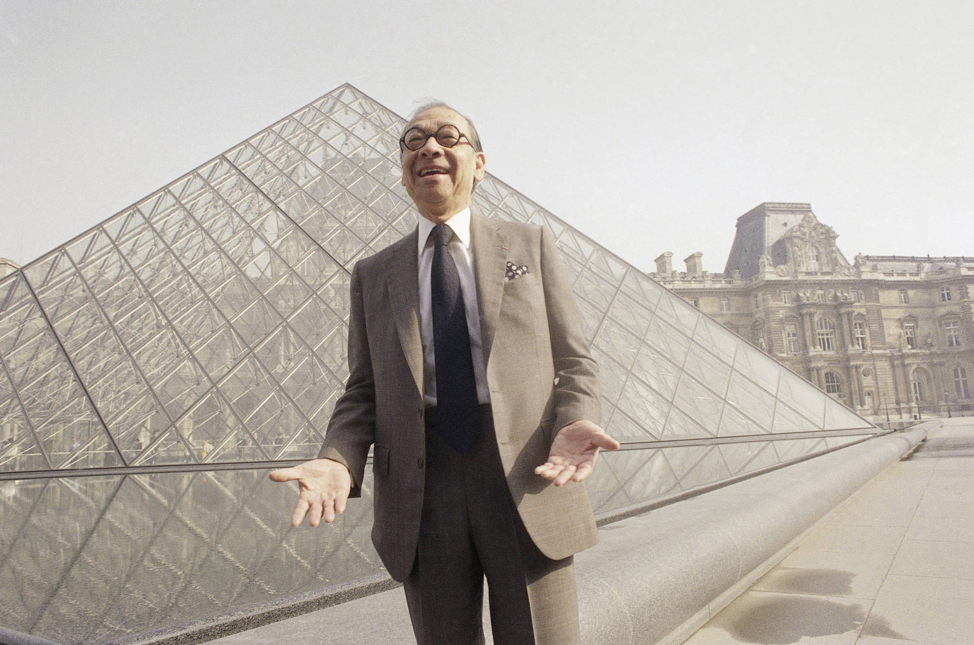 Architect I.M. Pei stands in front of the Louvre museum's glass pyramid in Paris, just before the structure's inauguration in March 1989.