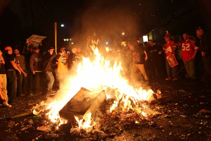 San Francisco Giants fans celebrate their team's winning of the World Series against the Detroit Tigers in San Francisco on Oct. 28, 2012. Fans stand around a pile of burning garbage in the street as the celebration becomes destructive.