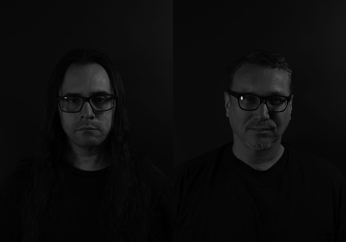 Black and white portraits of two men against a black background.