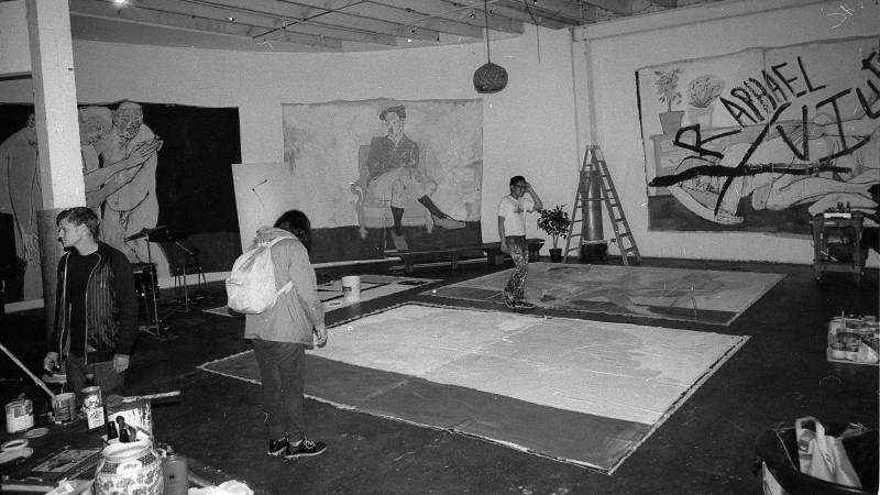 Jeff Cheung (back right) and others prepare for a group show at LoBot Gallery, an unpermitted live-work space in West Oakland that was evicted in 2016. 