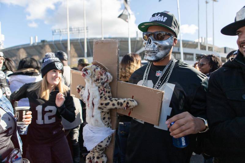 Raiders fans tailgate for the final Raiders home game at the Oakland Coliseum.