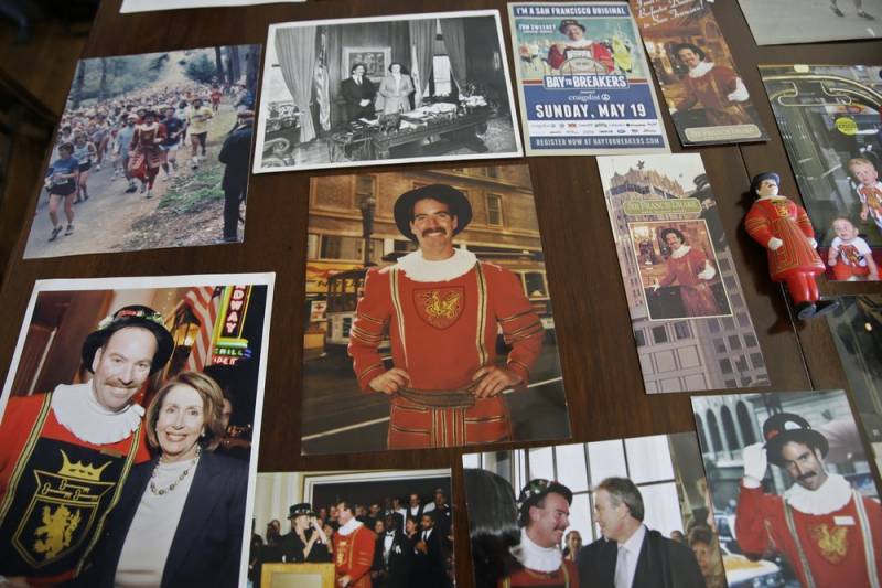 Photographs and memorabilia cover a table at Sweeney's home. 