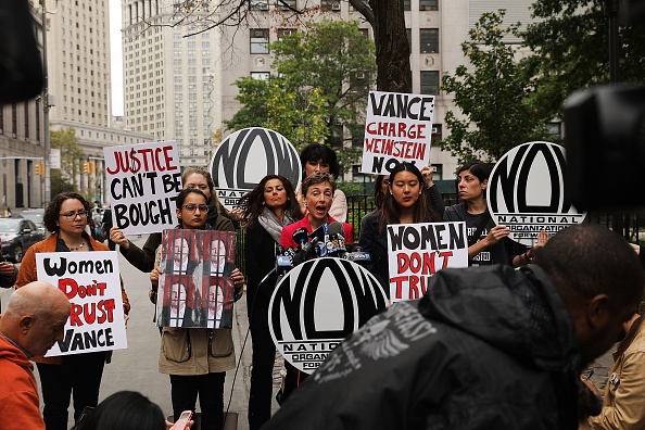 Members of the National Organization for Women (NOW) hold a news conference and demonstration outside of Manhattan Criminal Court, October 13.