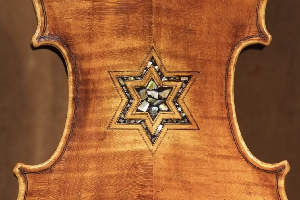 Detail of an affordably priced German model circa 1870s, designed for an unknown Klezmer musician, hence the inlaid mother of pearl Star of David.