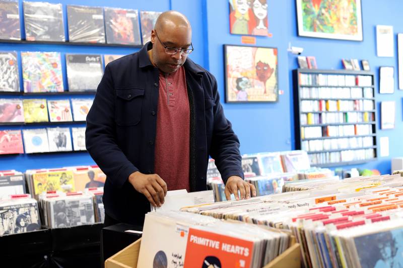 Mark Montgomery French browses the shelves at Econo Jam Records in Oakland.