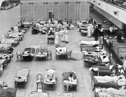 Red Cross volunteer nurses tend to flu patients at the Oakland Municipal Auditorium in 1918. It was used as a temporary hospital during the epidemic.