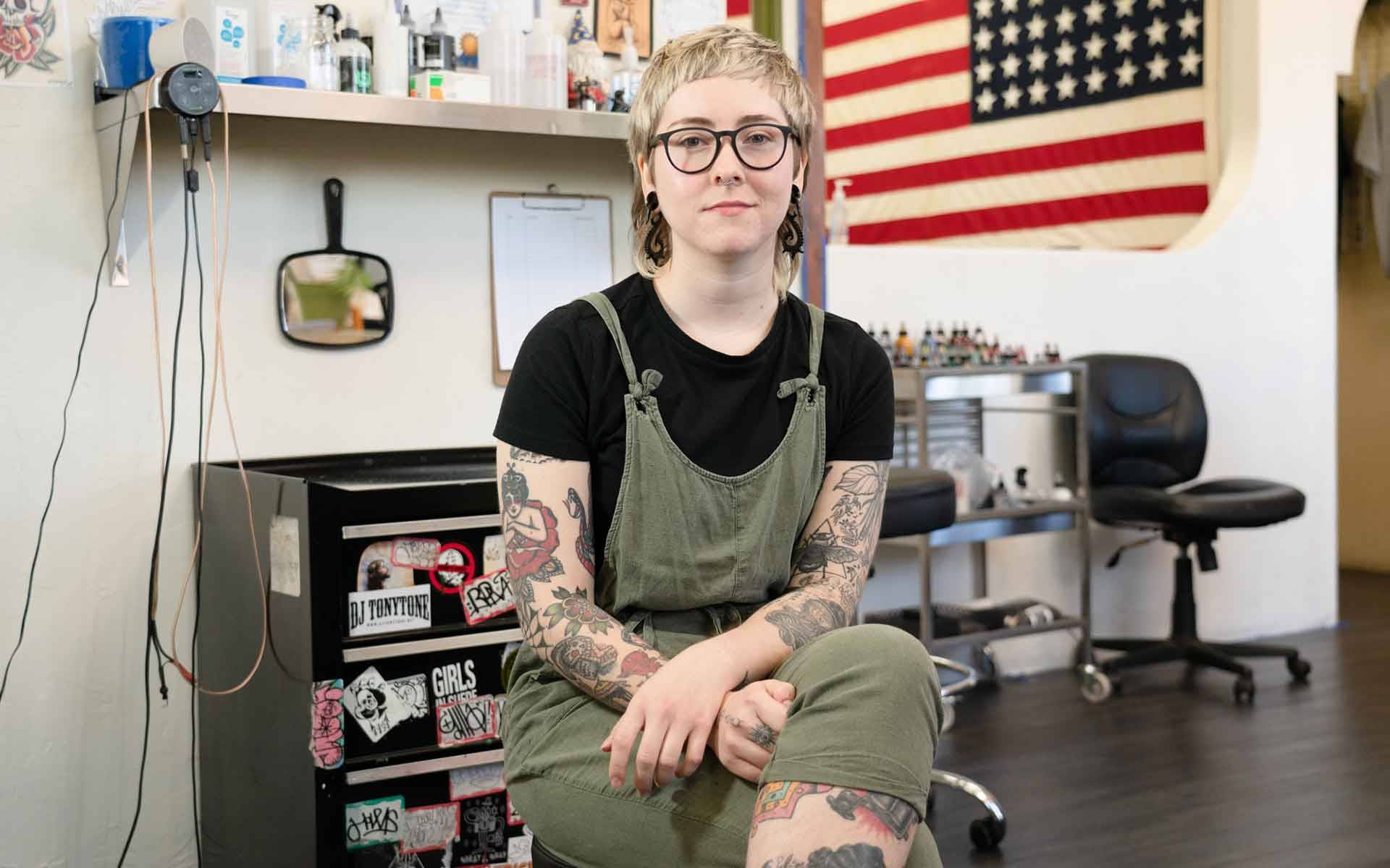 Emma Pierce at her tattoo station in Santa Rosa. The 23-year-old tattoo artist has been out of work for weeks due to the coronavirus shutdown. Graham Holoch / KQED