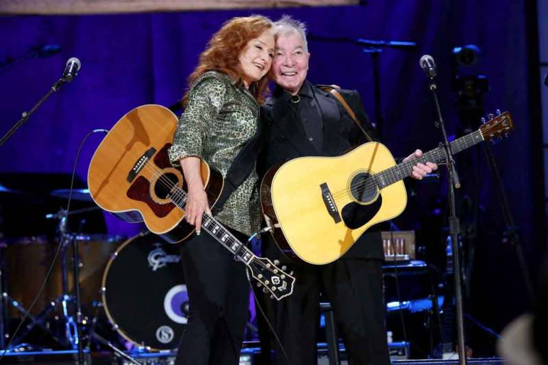 (L-R) Bonnie Raitt and John Prine perform onstage at the Ryman Auditorium in Nashville on September 11, 2019.