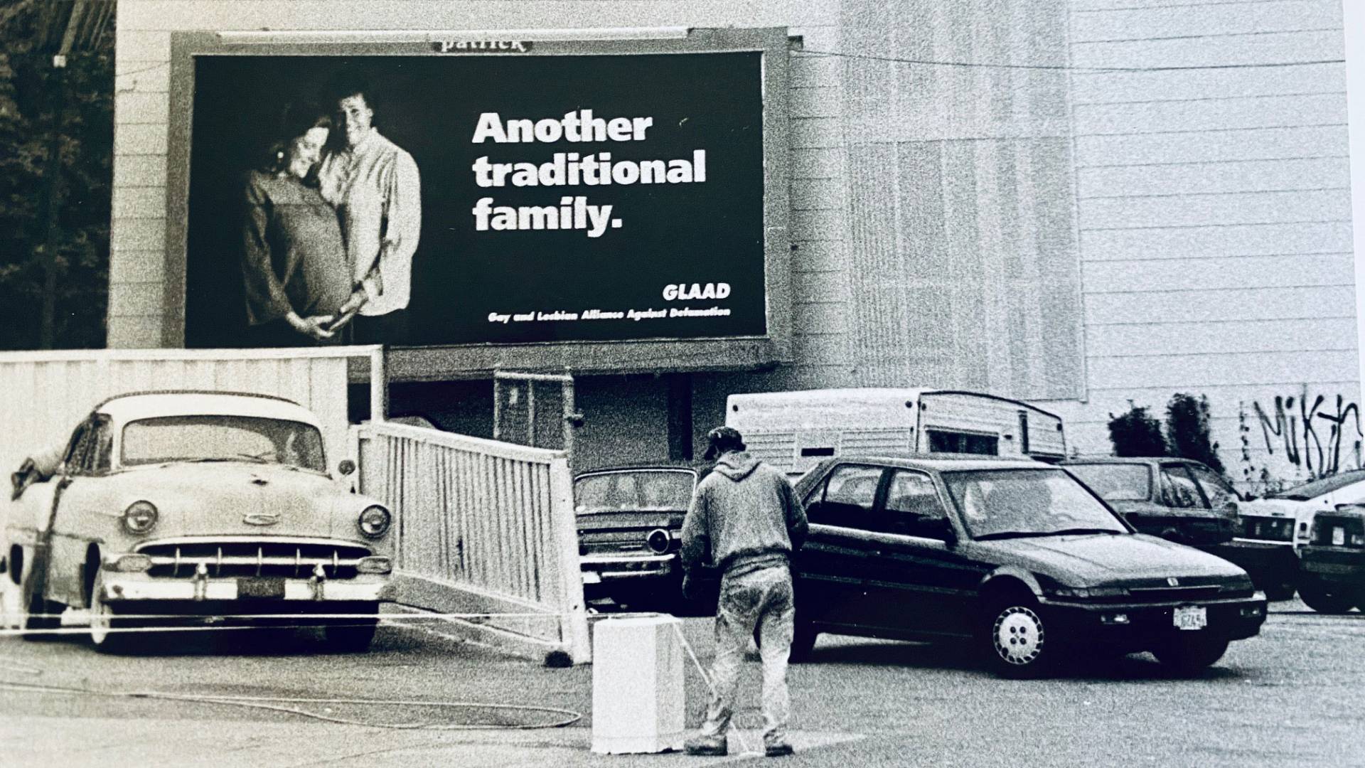 The billboard, photographed by Chloe Atkins and featuring Pat and Karen Norman, on the side of a building in 1992. Courtesy Chloe Atkins