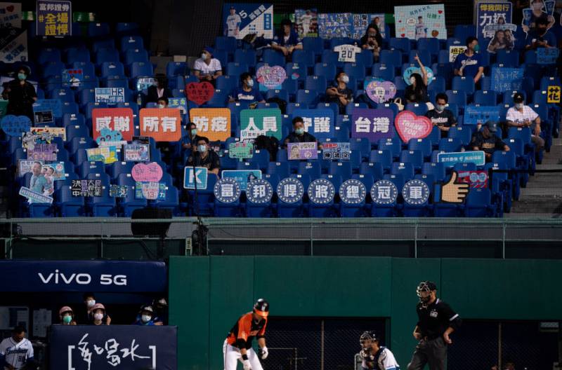 The Fubon Guardians and Uni-Lions play in front of 1000 socially distanced fans at Taipei’s Xinzhuang Baseball Stadium on May 08, 2020. The signs in the fifth row offer thanks to first responders. 