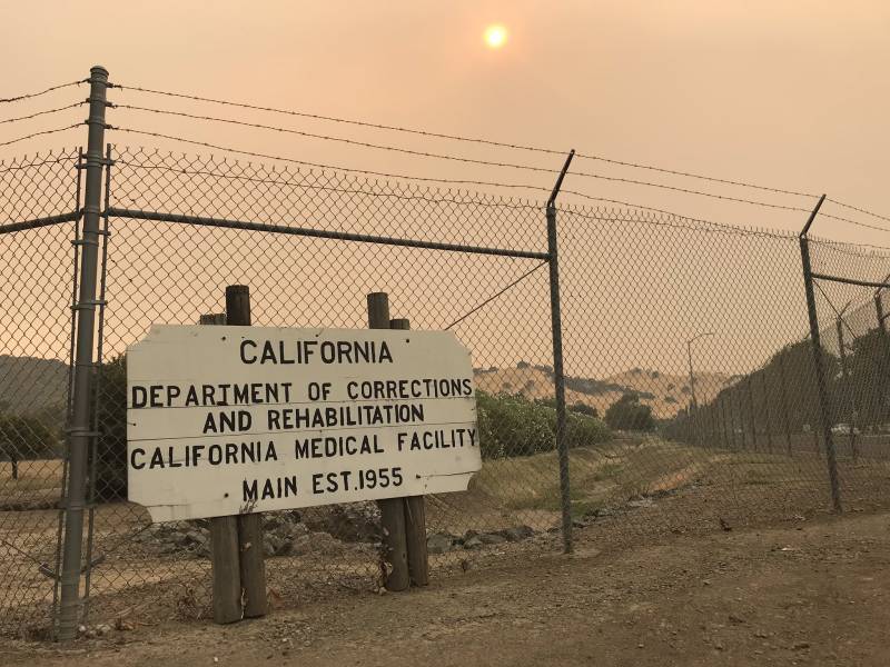 The sign outside of California Medical Facility state prison in Vacaville, on a smoky hot August afternoon