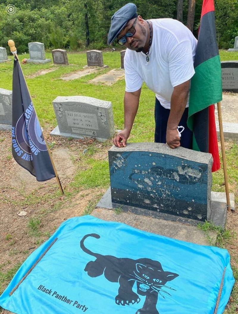 The tombstone of Black Panther Party Chairman Fred Hampton, Sr., which is shot up annually by officers in Haynesville, LA.