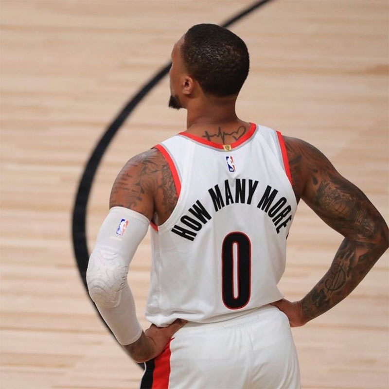 Damian Lillard, in a jersey reading 'How Many More,' worn during the 2020 NBA season.