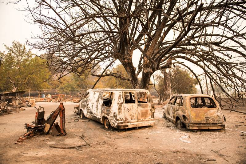 Vehicles burned by the LNU Lightning Complex sit off Pleasants Valley Road near Vacaville on Aug. 19, 2020.