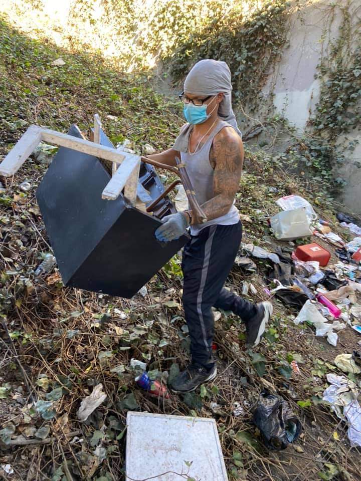 Vincent-Ray Williams III cleaning up garbage in Oakland as a part of his community service.
