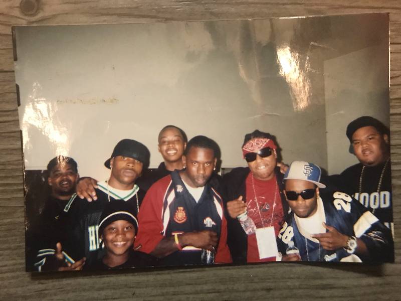 San Francisco rappers, including Ya Boy (sunglasses), San Quinn (center, far back), Bailey (Blue SF hat) and Big Rich (far right) pose for a photo at the Henry J. Kaiser Auditorium in Oakland. October 2005. 