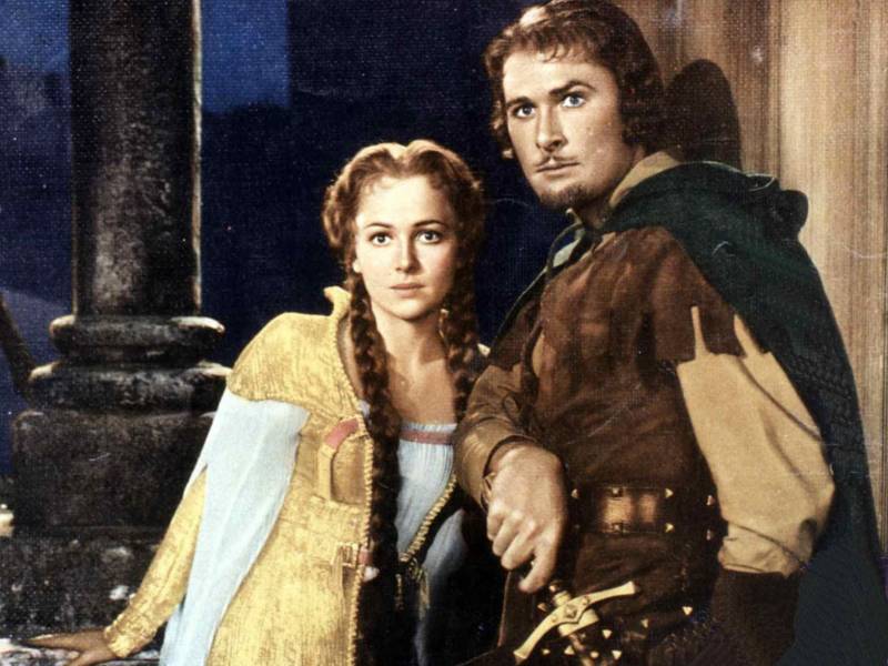 Errol Flynn and Olivia de Havilland, starring in 1938's 'The Adventures of Robin Hood.' Not to be confused with the Robinhood stock app.