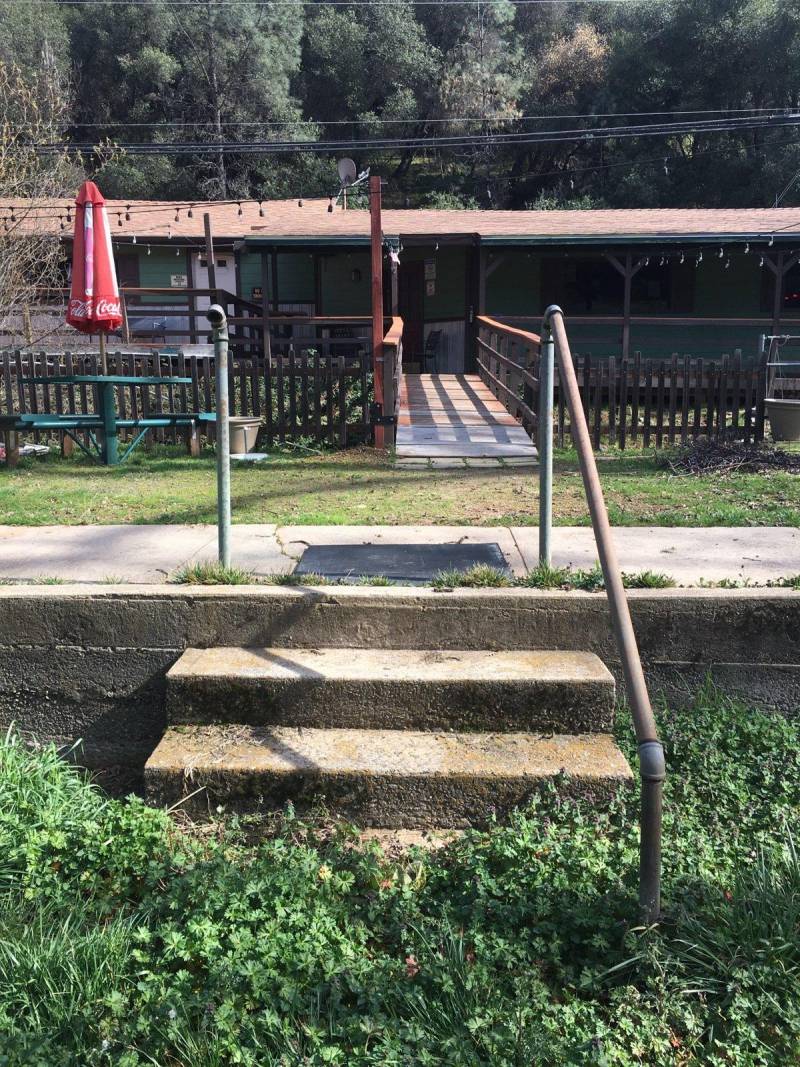 Old stairs from the swimming pool remain on the lawn outside the Dew Drop Inn.