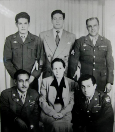 Enriqueta Andaloza surrounded by her sons, all World War II veterans. L-R: Joe Ramírez (kneeling), Edgardo Ramírez, John Ramírez, Abraham Salgado (her son-in-law) and Paul Ramírez.