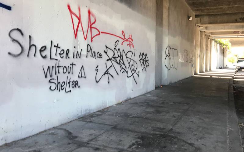 Graffiti on an underpass in Oakland: "Shelter in Place Without a Shelter."