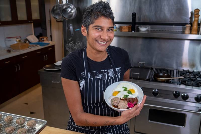 Preeti Mistry in the kitchen with her channa, eggs and sausage.