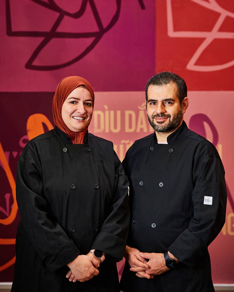 Wafa (left) and Mounir Bahloul pose inside the La Cocina Municipal Marketplace