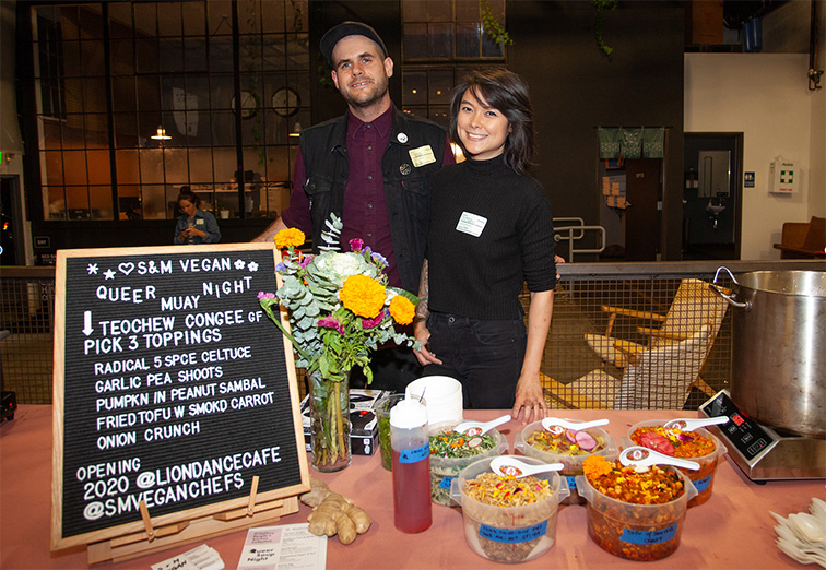 Shane Stanbridge (left) and CY Chia pose in front of the chalkboard menu at an earlier pop-up incarnation of their restaurant.