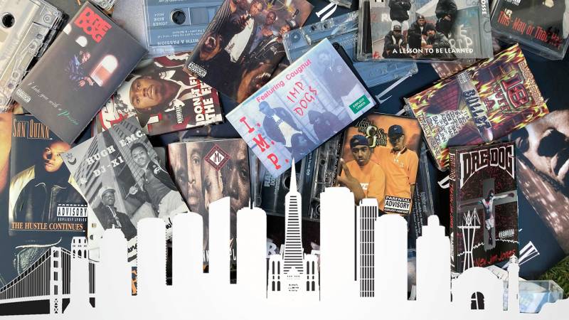 A pile of rap tapes from San Francisco set against the SF skyline