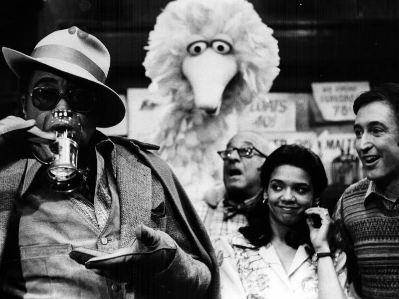James Earl Jones guest stars on 'Sesame Street' with regular cast members Big Bird, Mr. Hooper (played by actor Will Lee) and Maria (actor Sonia Manzano).