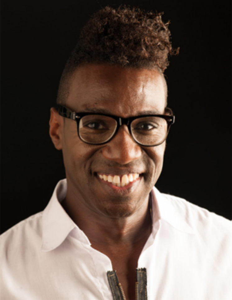 Headshot of Karter Louis smiling in glasses and a white collared shirt.