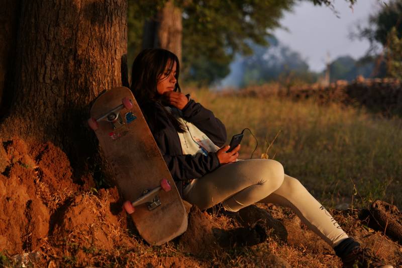 Asha Gond, 21, with her skateboard. She tried the sport when a skatepark was set up in her rural village and is now one of India's top female skateboarders.