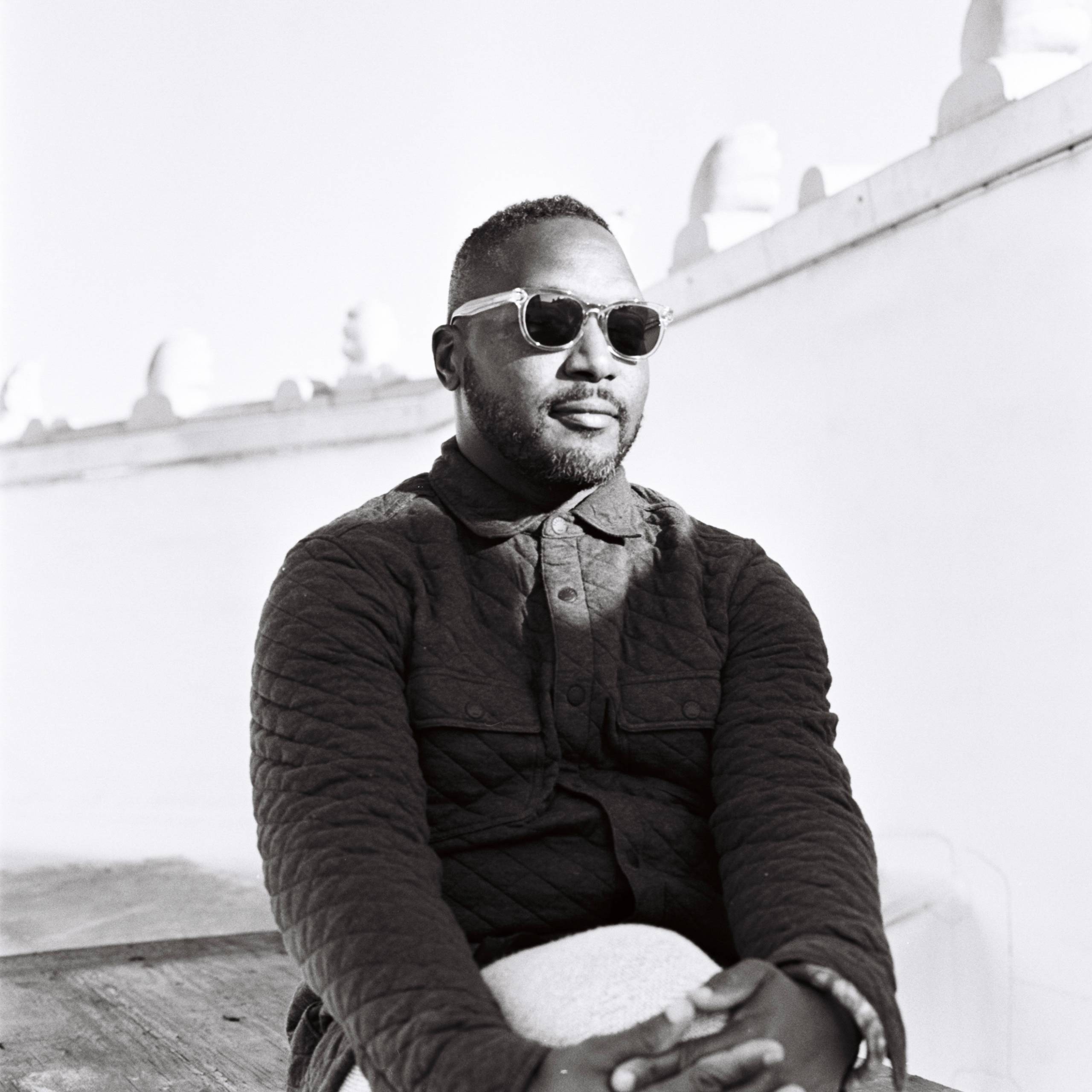 Black and white author headshot for Bryant Terry, posing in sunglasses.