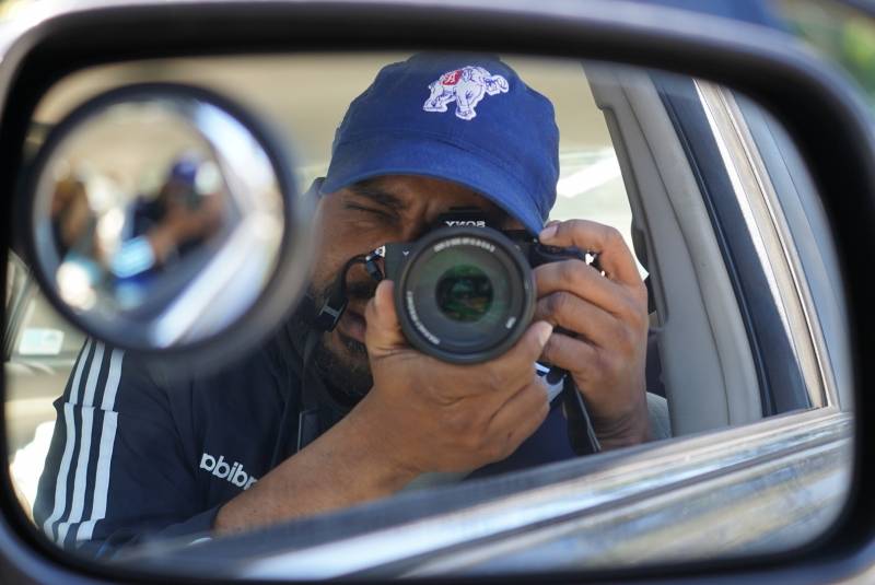 The author, Pendarvis Harshaw, in the rear-view mirror.