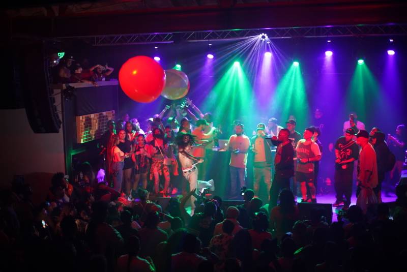 10 Piece Tone punches an oversized beach ball in the air while performing at Cornerstone in Berkeley. 
