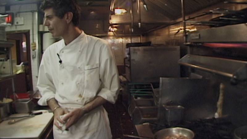 Anthony Bourdain pictured in his restaurant kitchen during his younger years, in a still shot from the new 'Roadrunner' documentary.