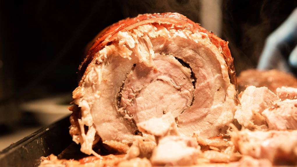 Cross section view of Jeepney Guy's lechon-style roast pork belly with crispy skin.