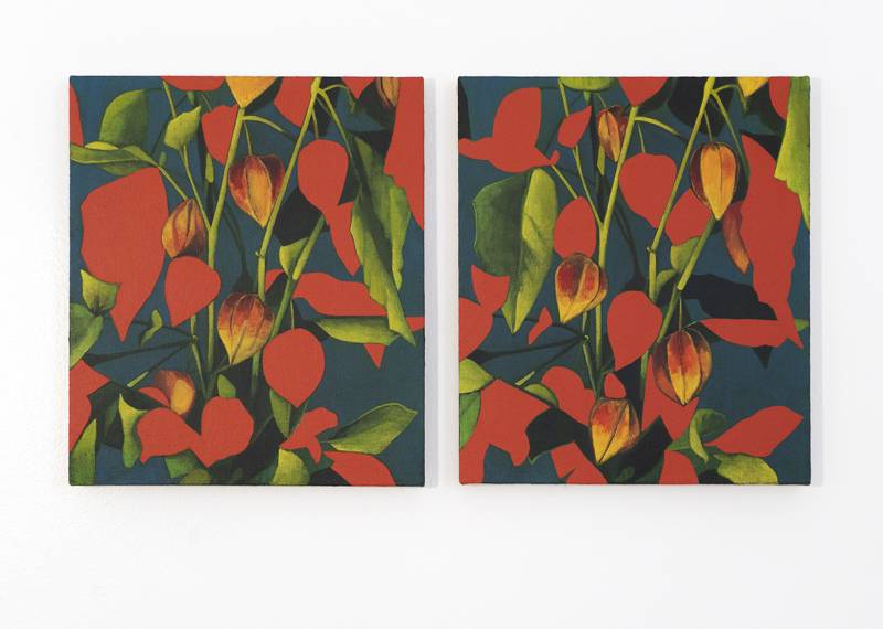 Two vertical paintings of red and green leaves.