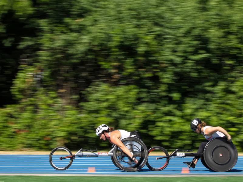 Tatyana McFadden, center, and Jenna Fesemyer of the United States compete in the Women's 5000 Meter Run T53/54 Wheelchair final during the 2021 U.S. Paralympic Trials at Breck High School on June 18, 2021 in Minneapolis, Minnesota.