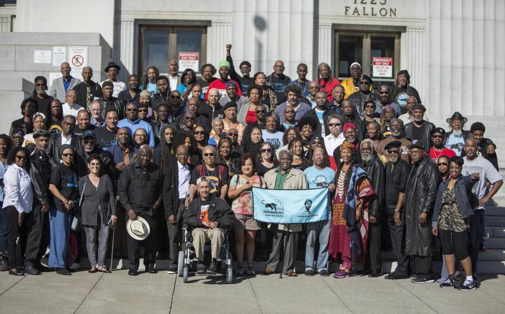 Black Panther Alumni gathering and celebrating the 50th anniversary of the founding of the Black Panther Party as they stand on the steps of the Alameda County Court House.