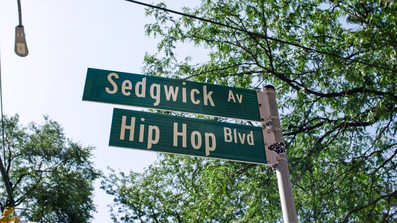 A close-up shot of Sedwick avenue and Hip-Hop boulevard street signs in New York City.