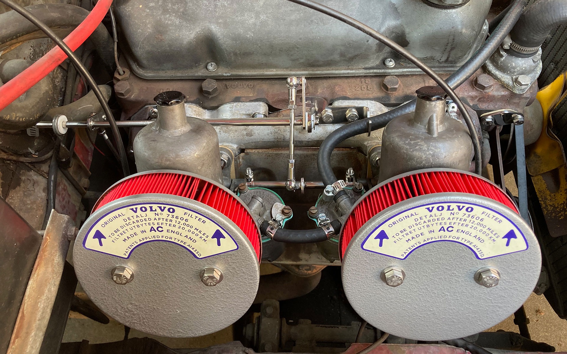twin SU carburetors attached to a vintage volvo engine
