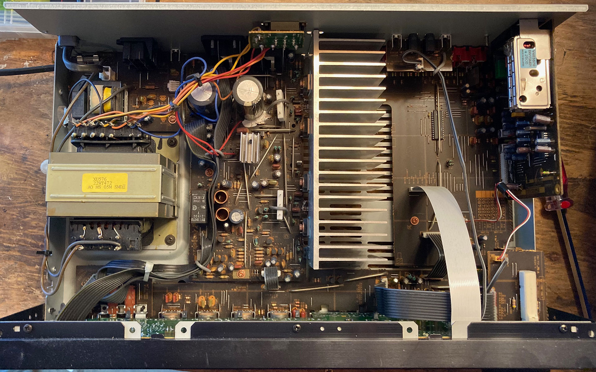 the inside of a Yamaha stereo receiver, showing wires and transformers