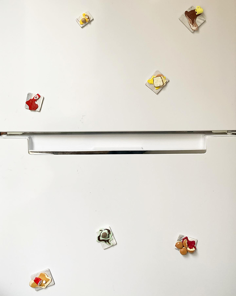 Small food sculptures on a fridge
