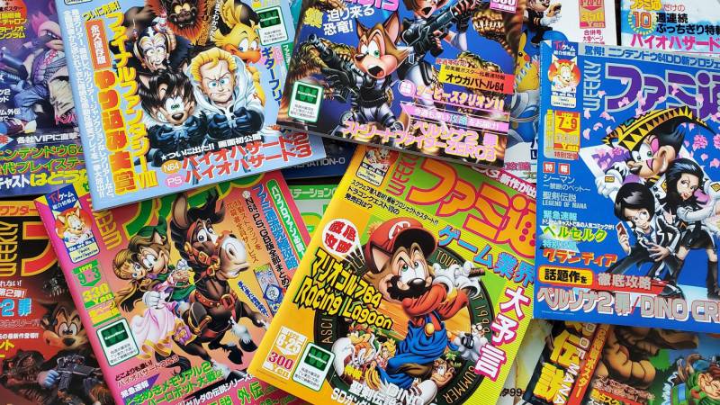 A pile of brightly colored magazines with Japanese text and cartoon images