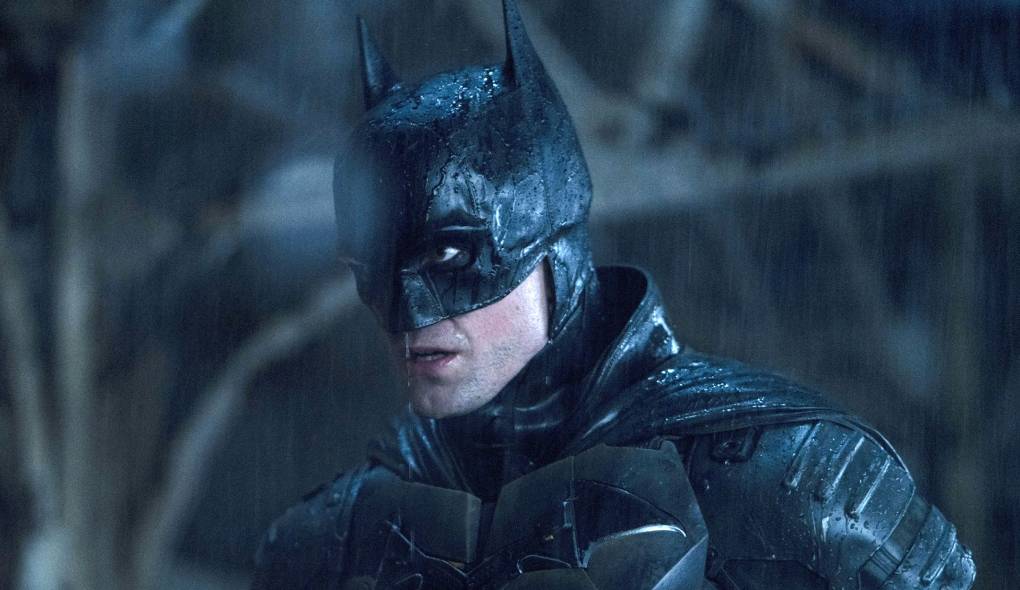 A white man in a mask with bat ears in the rain